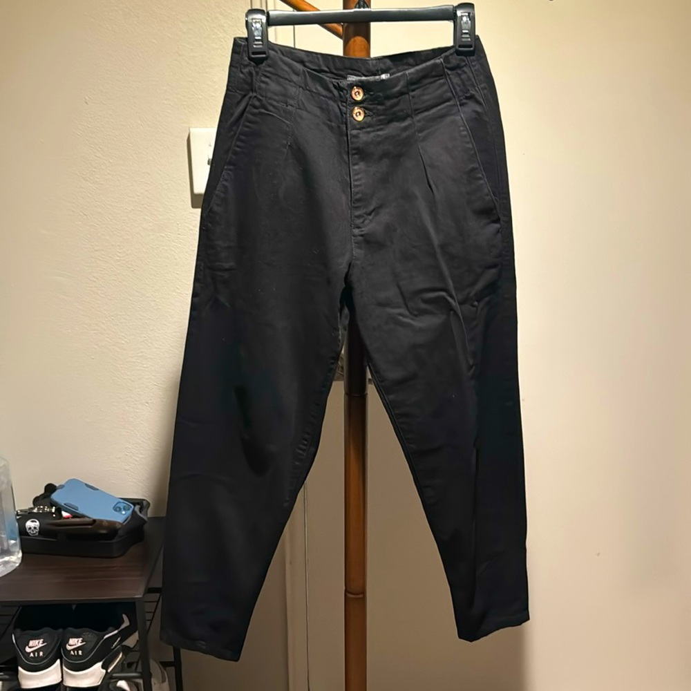 High waisted, baggy jeans with stylish zipper detail